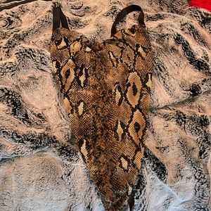 Snake skin body suit.